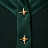 NAKHLAH close-up of branching silk bands with gold star details.