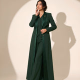 NAKHLAH blazer in Deep Saudi Green, full-length editorial pose.
