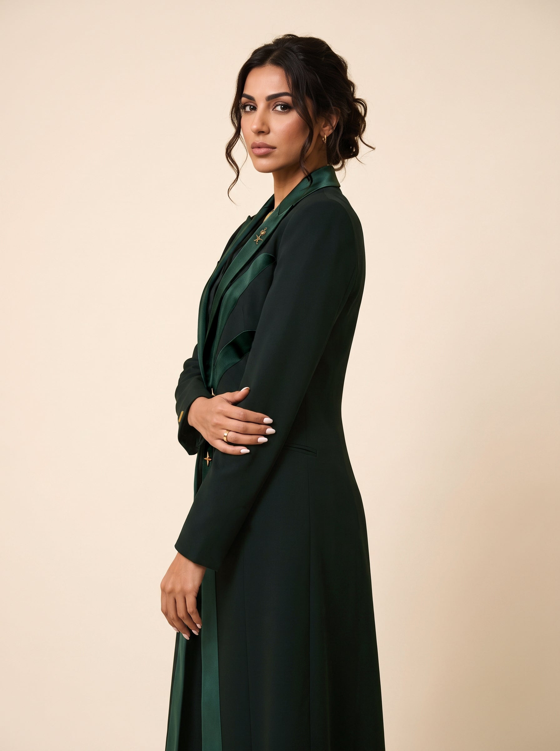 NAKHLAH long blazer in a three-quarter view showing the palm-inspired silk lines and tailored shape.