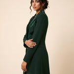 NAKHLAH blazer in Deep Saudi Green, three-quarter view of the flowing lines.