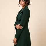 NAKHLAH blazer in Deep Saudi Green, three-quarter view of the flowing lines.
