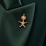 GLORY green silk lapel close-up with the gold Saudi palm-and-crossed-swords emblem.