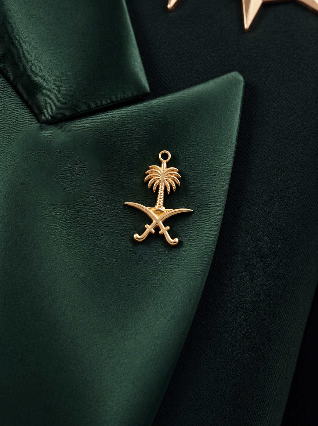 GLORY lapel close-up with the gold Saudi palm-and-crossed-swords emblem.