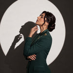 GLORY blazer in an editorial side portrait with gold stars and the Saudi emblem.