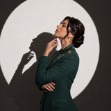 GLORY blazer in an editorial side portrait with gold stars and the Saudi emblem.