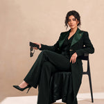 GLORY blazer in Deep Saudi Green, seated editorial full look.