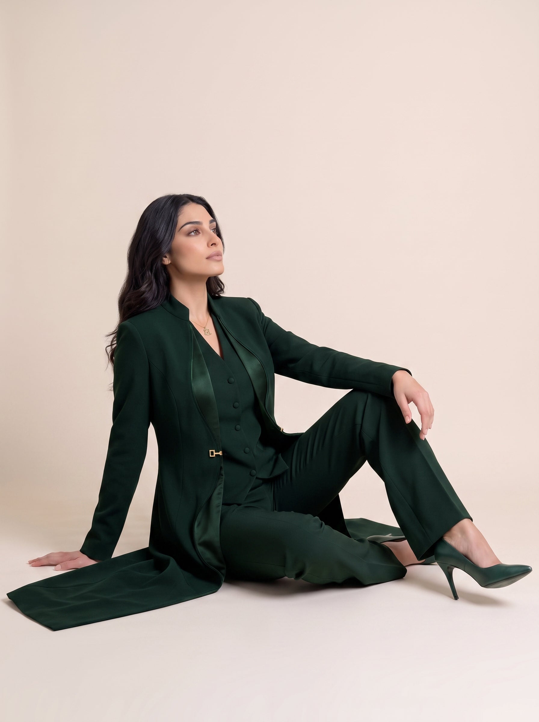 TERRA blazer in Deep Saudi Green, seated editorial full look.