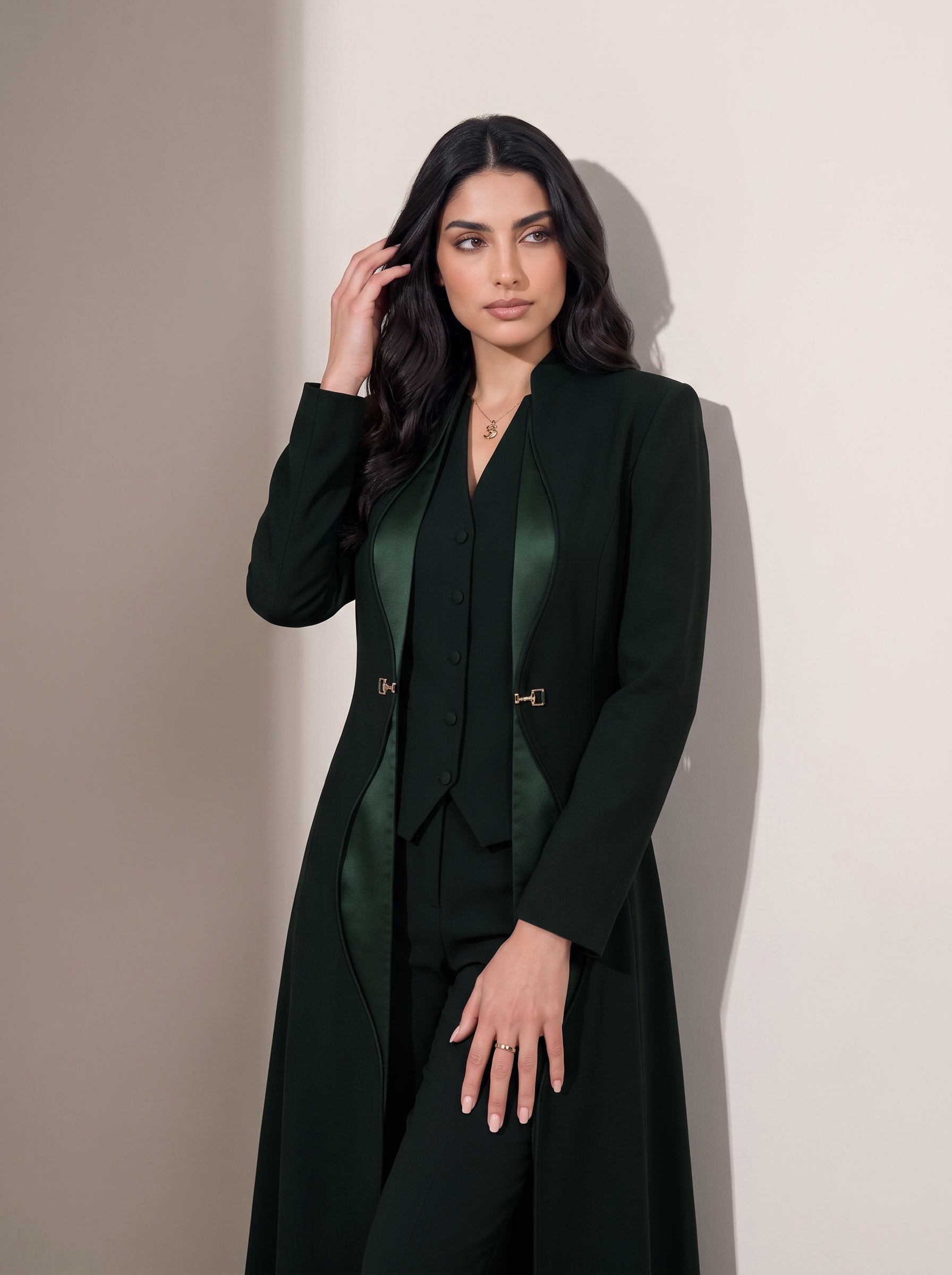 TERRA open-front editorial portrait showing curved green silk trim, the coordinating vest and gold-tone hardware.