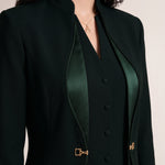 TERRA upper-front detail showing the standing collar, curved Japanese silk trim and gold-tone waist hardware.