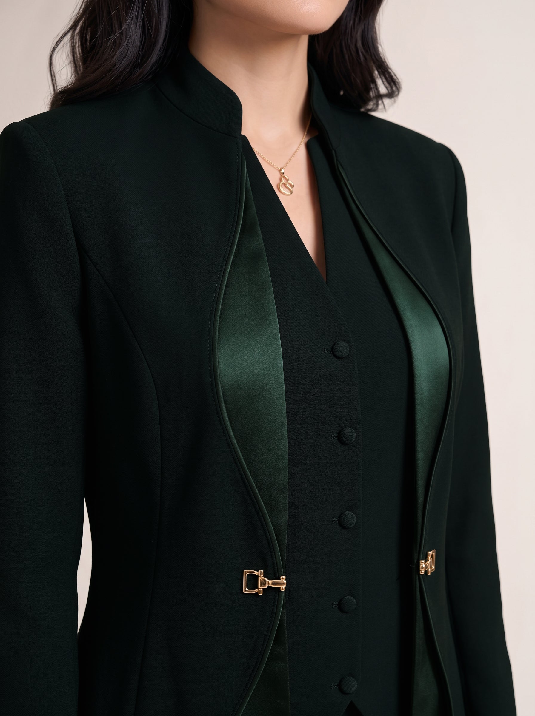 TERRA upper-front detail showing the standing collar, curved Japanese silk trim and gold-tone waist hardware.