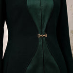 TERRA contour-inspired green silk panels and gold-tone front waist closure, close-up.