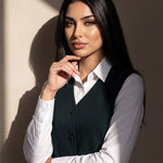 WAQAR formal set in Deep Saudi Green, seated editorial full look.