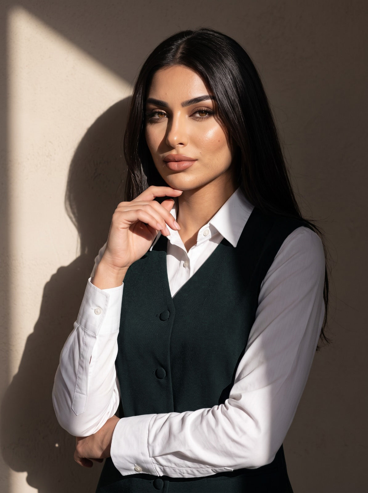 WAQAR formal set in Deep Saudi Green, seated editorial full look.