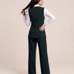 WAQAR formal set in Deep Saudi Green, full-length editorial pose.