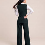 WAQAR formal set in Deep Saudi Green, full-length editorial pose.