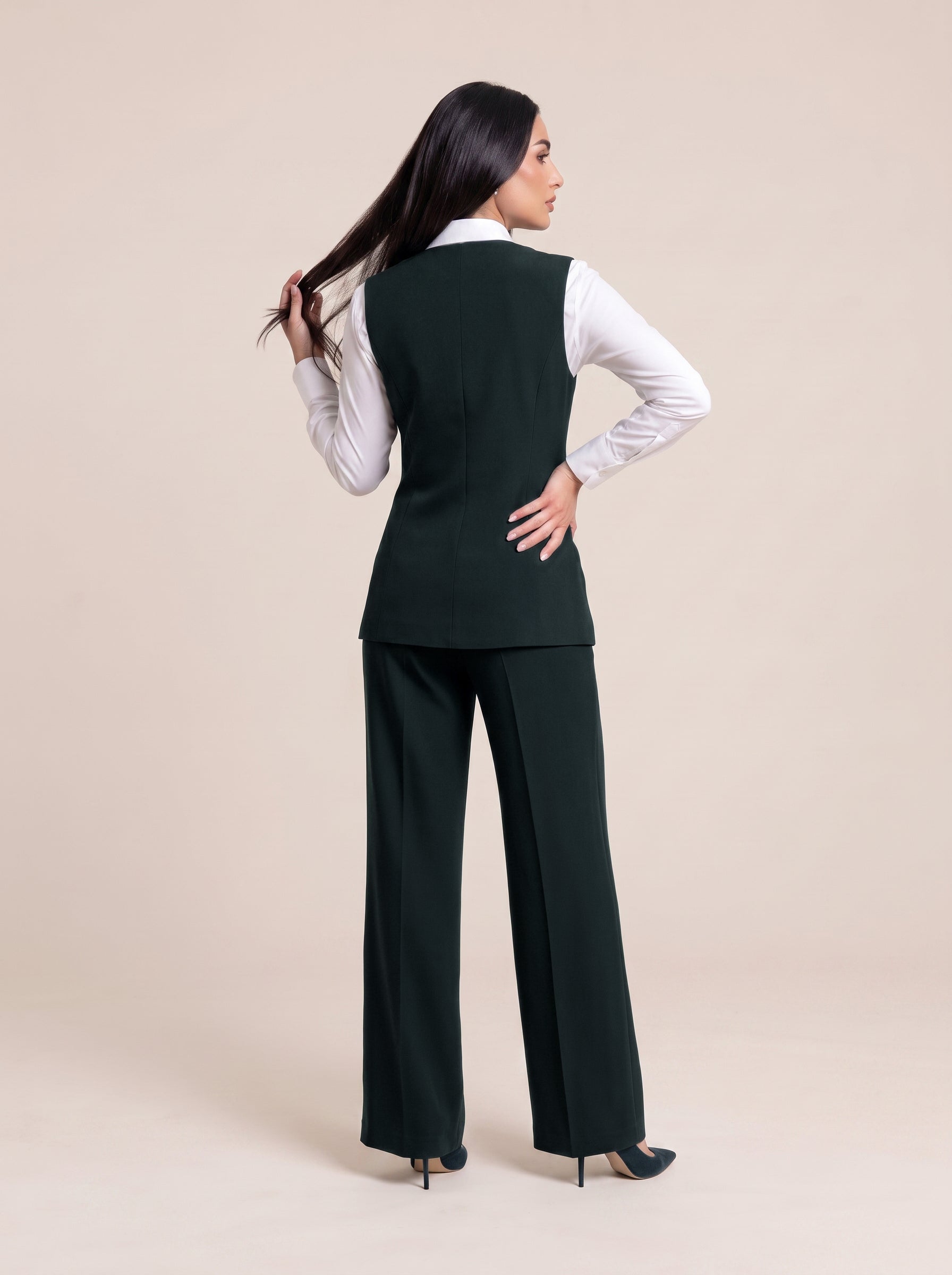 WAQAR formal set in Deep Saudi Green, full-length editorial pose.
