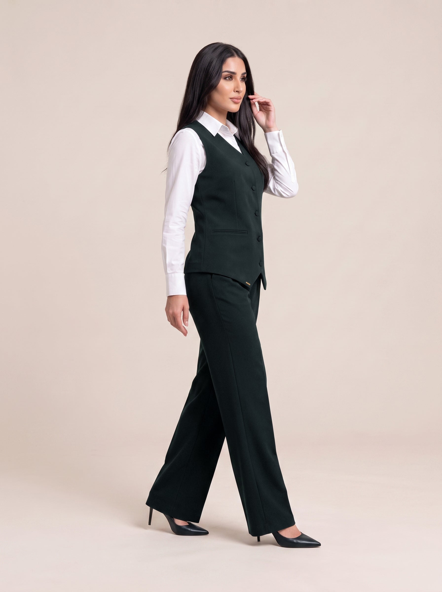 WAQAR formal set in Deep Saudi Green, side view with wide-leg trousers.